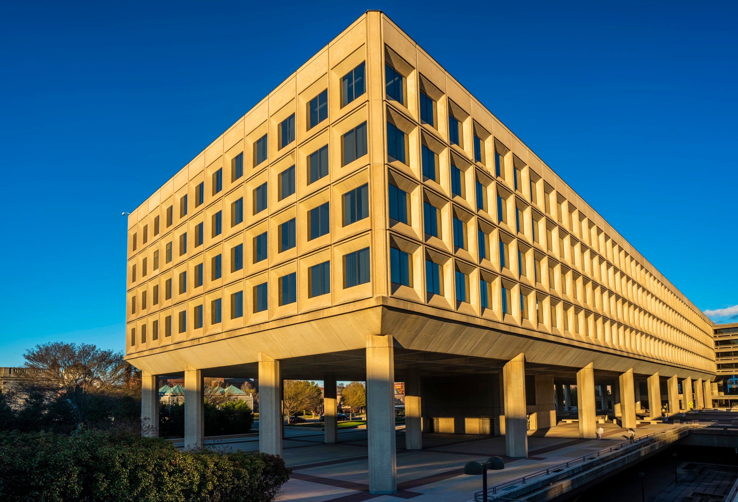 Photo of the the Department of Energy Building in downtown Washington DC, USA, against a blue backdrop.